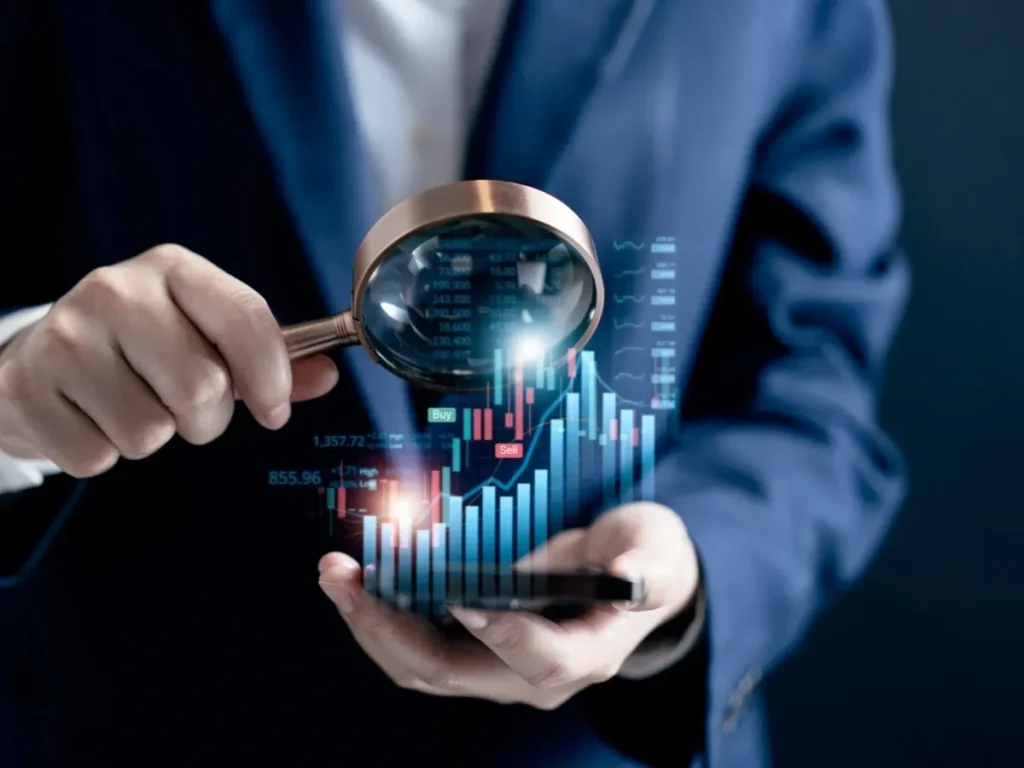 Analyst examining a holographic stock chart through a magnifying glass